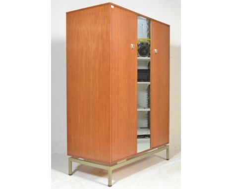 Leslie G. Dandy - G Plan - Limba Range - A 1960's retro vintage limba wood wardrobe having a mirrored door raised on metal sq