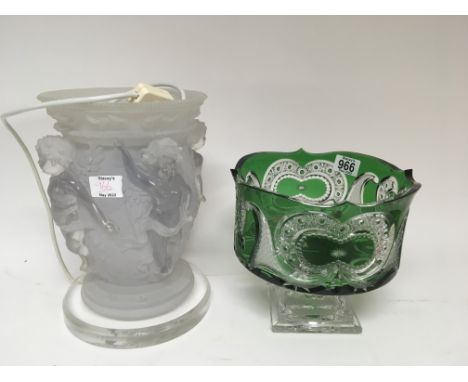 A green flashed glass and cut bowl on a stepped base and a modern table glass lamp with raised figures no obvious damage. (2)