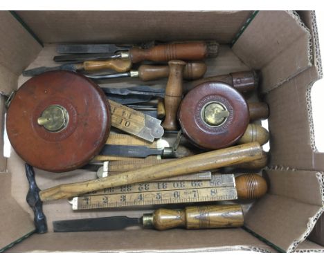 A collection of vintage tools including two Rabone &amp; Sons measuring tapes.