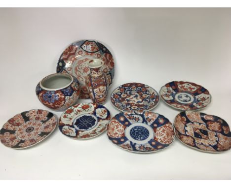 A collection of late 19th century Imari plates a jardiniere and vase. (Vase damaged)