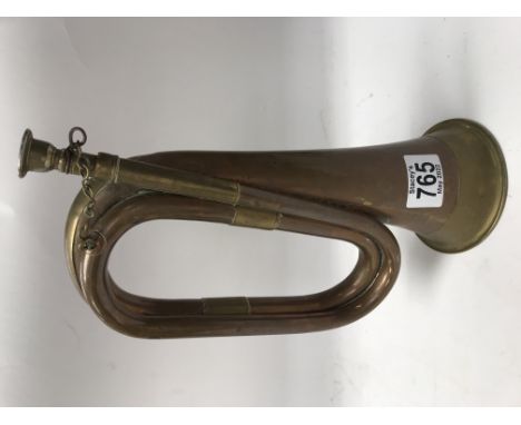 A copper and brass bugle with mouthpiece