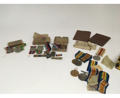 A collection of groups of of I &amp; II world war medals awarded to 50356 Pte A.E Preston The Queens R (2) and two other I wo