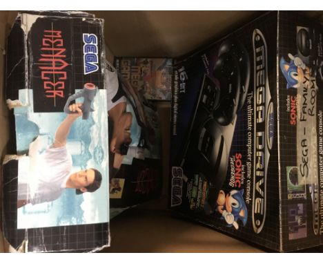 A boxed Sega Mega Drive, a Playstation 1 console, both with games and accessories.