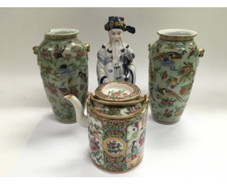 Four Oriental ceramic items comprising a pair of vases, teapot and a figure of a scholar, approx height of scholar 25cm.