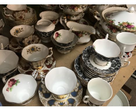 A Collection of Royal Albert including country rose comprising tureans dinner plates cups sauces teapots