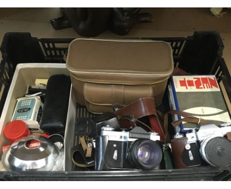 Two Zenite SLK cameras model B and E, as well as telephoto lenses and a quantity of other accessories.