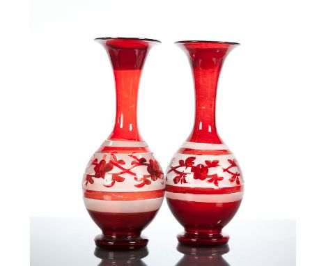 PAIR OF RUBY GLASS ETCHED VASES with trumpet mouths and rounded bodies, with floral motifs, 26.5cm high 