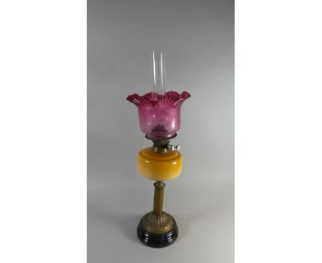 A Late Victorian Brass and Glass Oil Lamp with Cranberry Shade (Small Chip to Rim) 