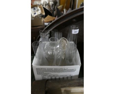 A Collection of Ten Glass Oil Lamp Chimneys and Roll of Wick
