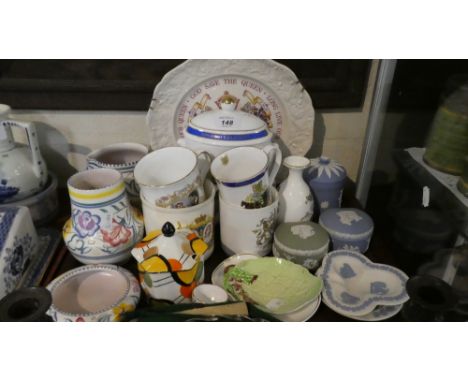 A Tray of Ceramics to Include Wedgwood Jasperware, Poole Jug, Vase and Dish, Ringtons Tea Caddy, Commemorative Mugs Etc