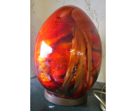 Sylvie Montagnon - an art glass lamp on circular wood base entitled 'Lampe Oeuf' mottled red and orange design with certifica