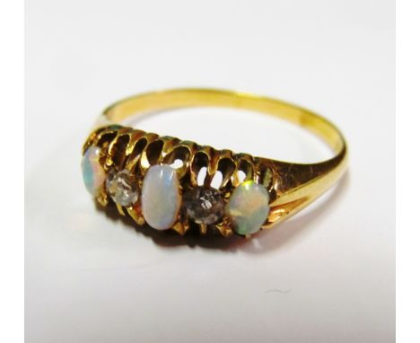 An 18ct gold ring opal and diamond size U/V