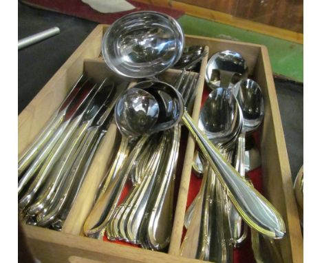 A twelve place setting set of  plated cutlery with gilt edges (one fork deficient)