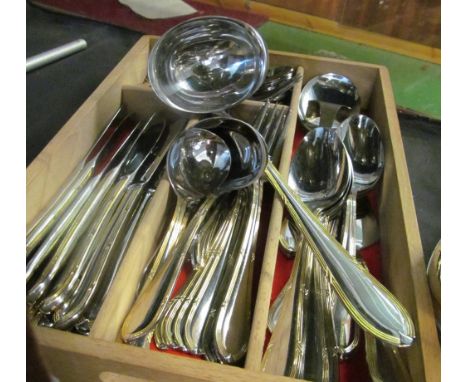 A twelve place setting set of  plated cutlery with gilt edges (one fork deficient)