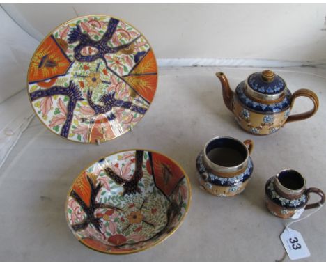 A 19th Century english Imari bowl and plate and a Royal Doulton teapot, sugar bowl and jug with silver rims (a/f)