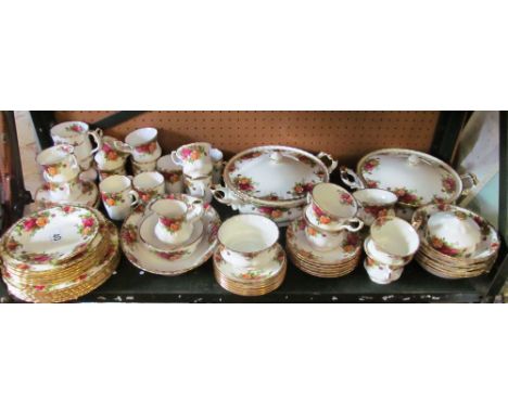 A Royal Albert Old Country Roses part tea/dinner serivce:- gravy boat (a/f) and stand, two lidded tureens, oval serving dish,