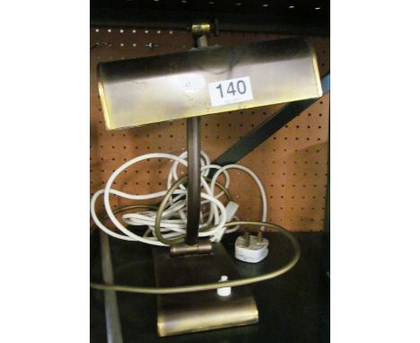 A brass desk lamp