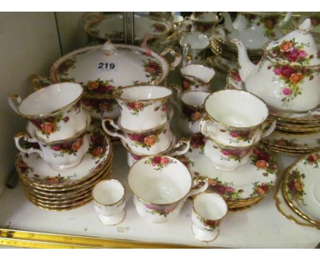 A Royal Albert Old Country Roses part dinner service:- two tureens, six dinner and six side plates, seven saucers, seven cups