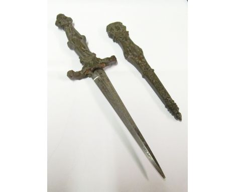 A metal knive in scabbard, 2 relief ladied on handle 9"