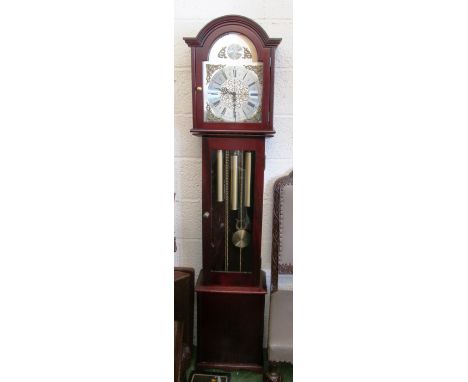 A modern mahogany grandmother clock arched silvered dial with cherub spandrels, glass door revealing three train weights and 