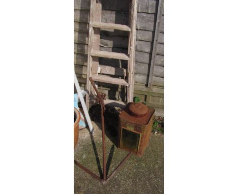 A vintage wooden ladder, anchor and a cannister with window