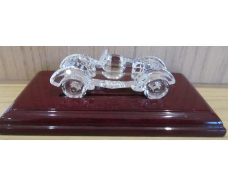 A Swarowski silver crytal vintage car on stand retired 1995