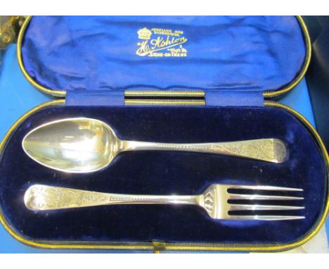 A silver christening set spoon and fork (i.c) and a silver brush and comb set (i.c)