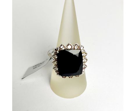 A limited edition 14ct black spinel and white topaz silver ring with certificate.