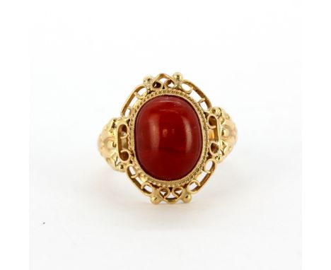 A yellow metal (tested high carat gold) red jasper set ring, (N). Weight - 5.9g