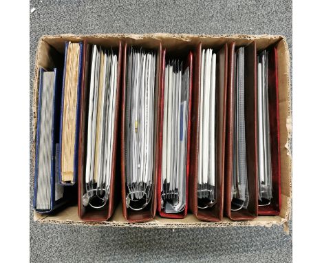 A box of Guernsey stamps and first day covers in albums.