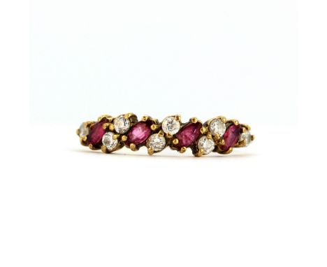 A 9ct yellow gold ring set with marquise cut rubies and white stones, (M.5).