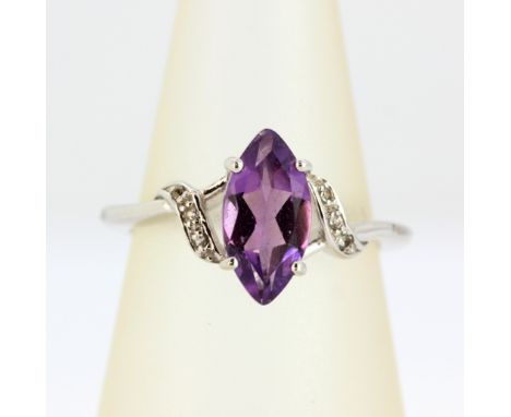 A 9ct white gold ring set with a marquise cut amethyst and diamonds, (N).