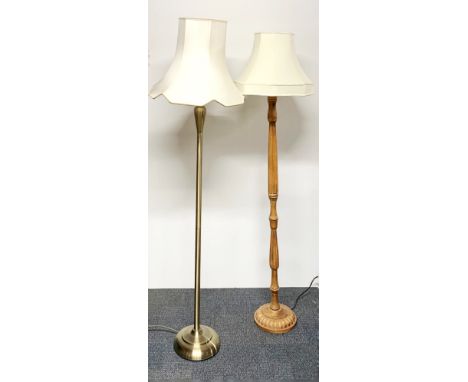 A brass standard lamp and a turned wooden lamp.