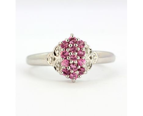 A 9ct white gold ring set with fancy pink sapphires and diamonds, (N).