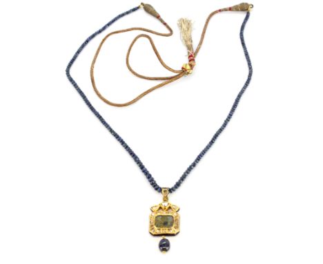 A large yellow metal (tested high carat gold, approx. 22ct) and enamel diamond and carved sapphire set pendant, L. 6cm, on a 