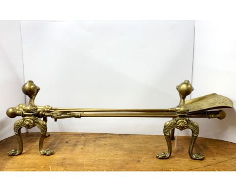 A set of Victorian brass fire dogs and tools, tool L. 72cm.
