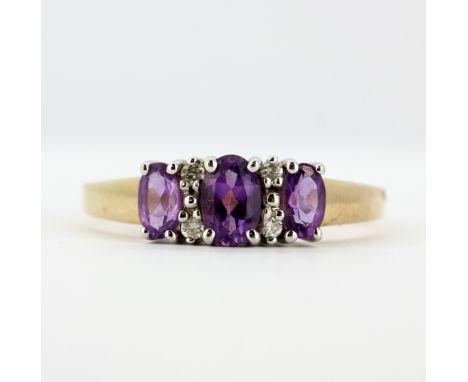 A 9ct yellow gold ring set with oval cut amethysts and diamonds, (S).