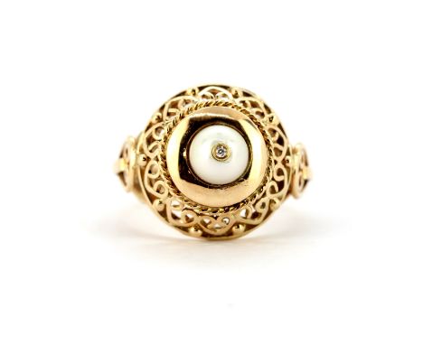 A yellow metal (tested 18ct gold) ring set with a pearl and a diamond, (M). Weight - 6.6g