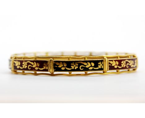 A 22ct yellow gold (marked 22k) and enamelled bangle, dia. 7cm. Weight - 25.5g