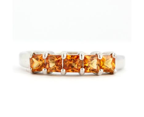 A 9ct white gold citrine set half eternity ring, (N).