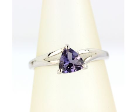 A 9ct white gold ring set with a trillion cut tanzanite, (N).