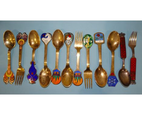 A collection of ten Danish silver gilt and enamel year spoons and forks, all signed with different artist's signatures, maker