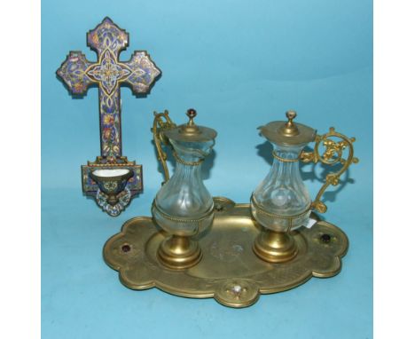 A 20th century Continental enamel metal cross and font, 23.5 x 12cm and a pair of glass jugs with metal mounts, on shaped ova
