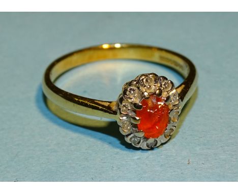 A fire opal and diamond cluster ring with 18ct gold mount, N 1/2, 3.2g, (fire opal badly chipped). 