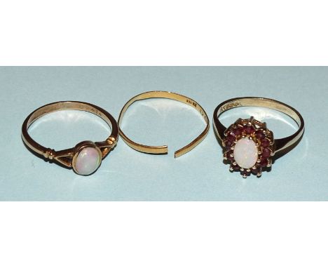 A 9ct gold ring collet-set an oval opal, size O½, 1.7g, a Victorian 22ct gold wedding band, (split), 0.9g and a gold-plated o