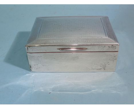 An engine-turned rectangular cigarette box, Birmingham (marks rubbed), 11cm wide. 