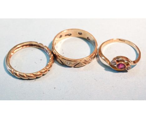 An 18ct gold crossover ring collet-set a ruby and two white stones, size K, 1.8g and two 9ct gold rings, sizes N and P, 4.5g.