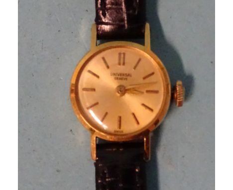 Universal Genève, a lady's 18ct gold manual wrist watch on leather strap, (winds and runs). 