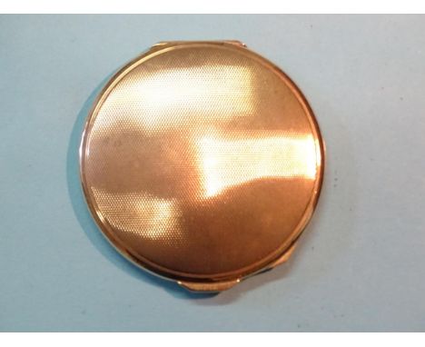 Mappin &amp; Webb, a 9ct gold engine-turned circular compact, Birmingham 1939, 6.7cm diameter, gross weight 48g. 