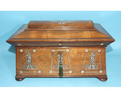 A Regency rosewood sarcophagus-shaped tea caddy inlaid with mother-of-pearl, having two lidded compartments and later mixing 